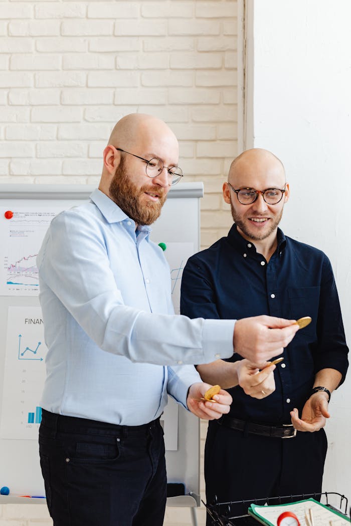 Two business professionals analyzing financial data in an office setting.